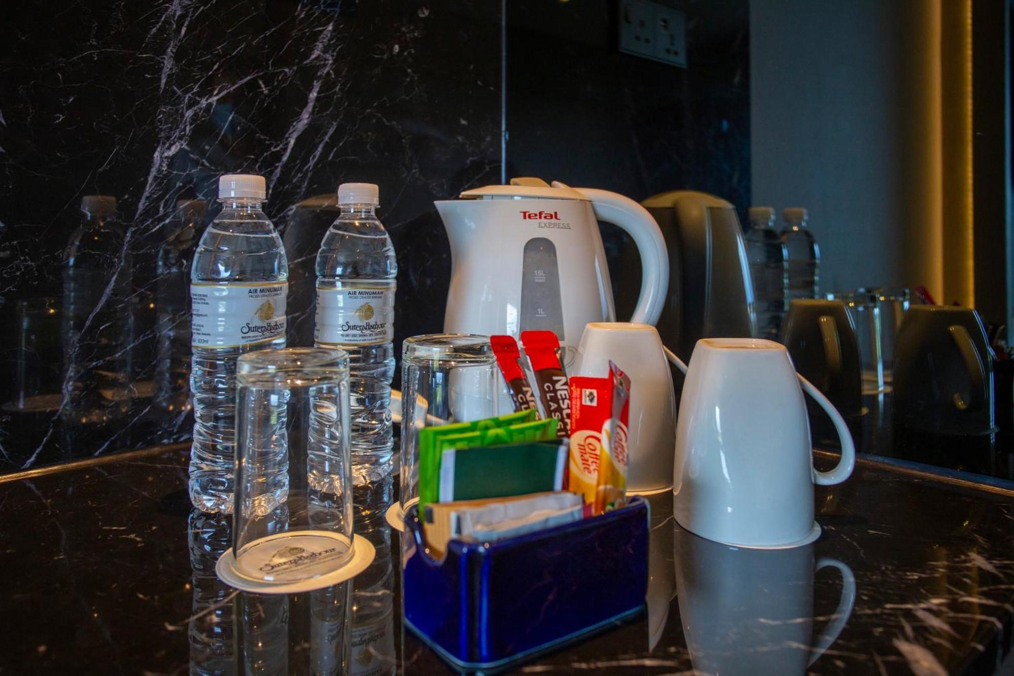 The Pacific Sutera Hotel Kota Kinabalu Exterior photo Bottled water in a hotel room